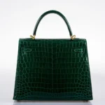 Hermès HSS Kelly 25 Sellier Emerald and Cassis Shiny Niloticus Crocodile Brushed Gold Hardware